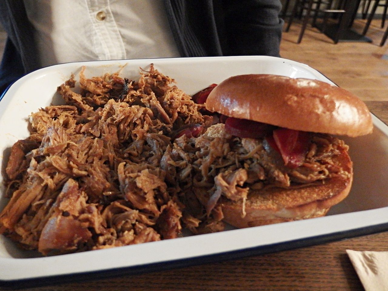 pulled pork and toasted bun at porky"s bbq